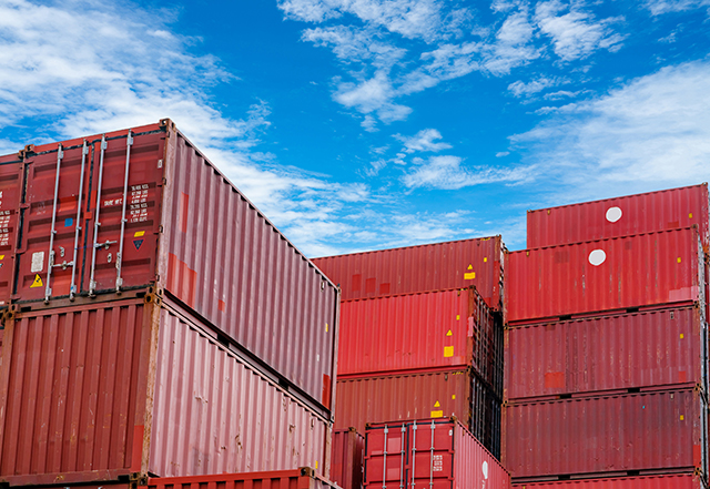 Red Cargo Containers in shipyard